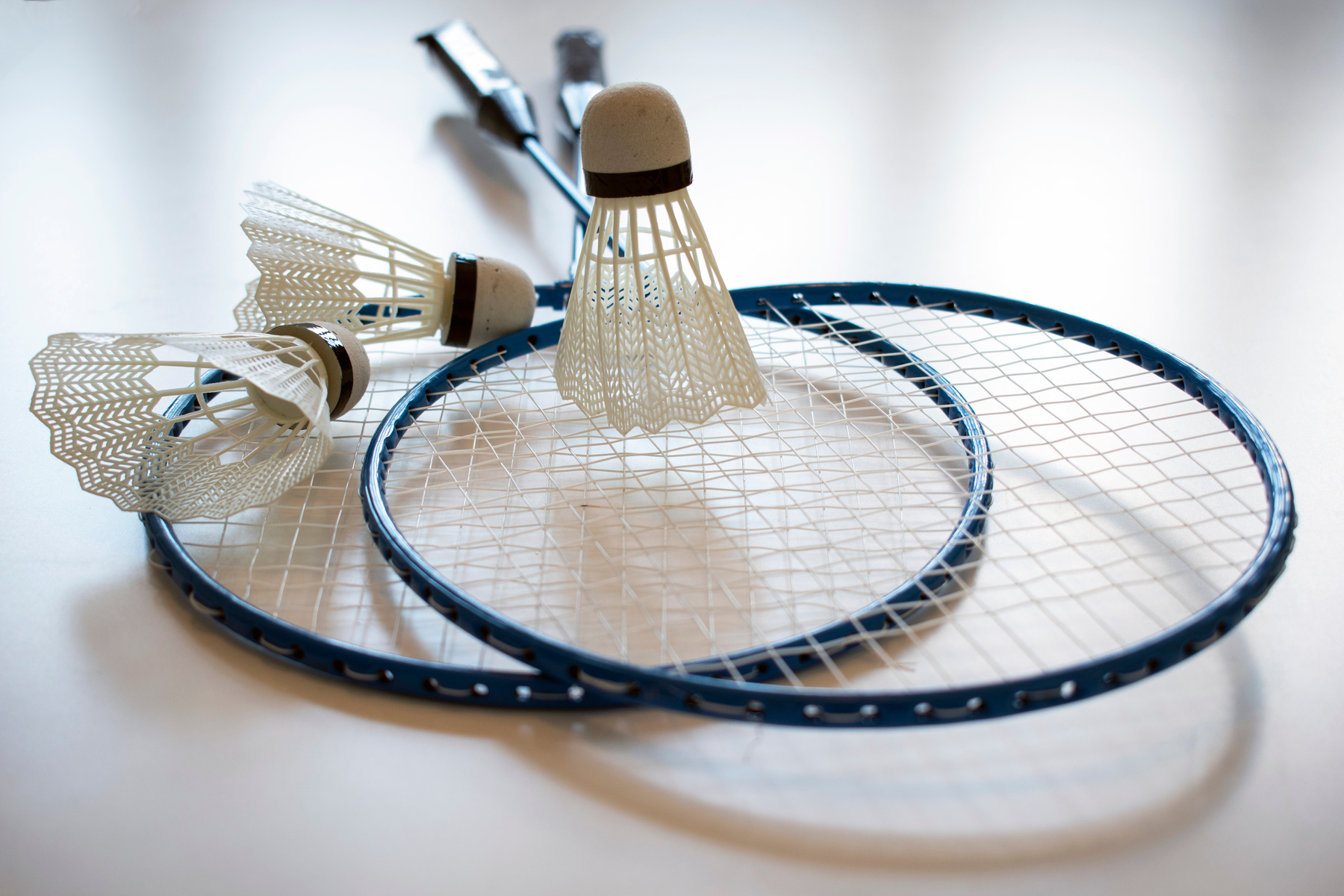Close Up Photo of Badminton Rackets and Shuttlecock